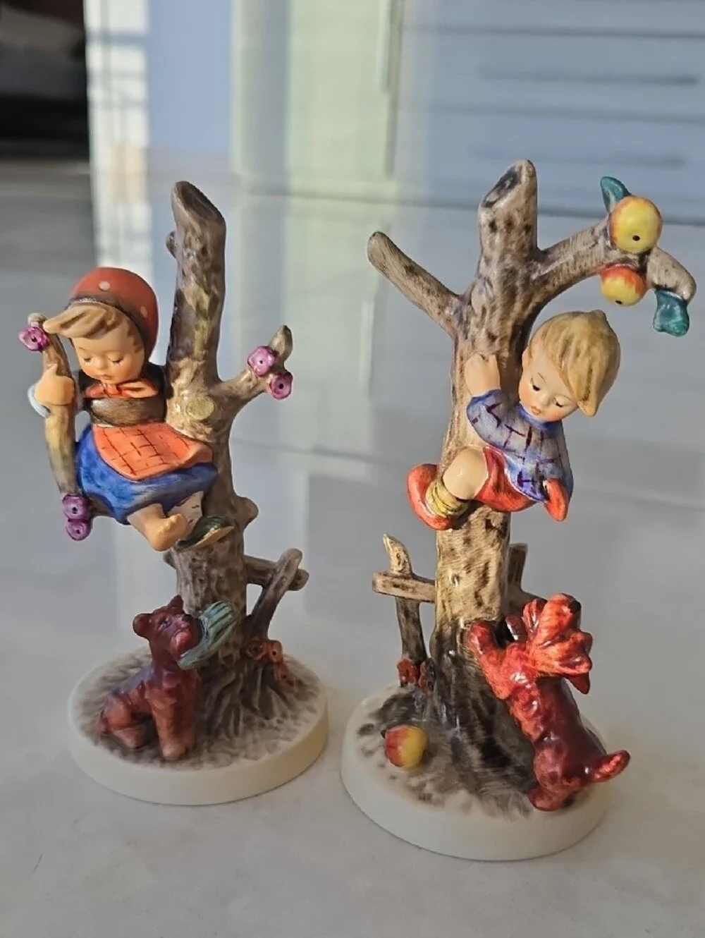Set Of 2 Hummel Figurines - Out Of Danger and Culprits - Boy And Girl In Trees